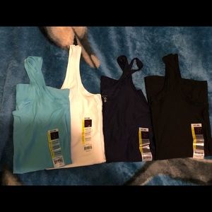 4 tank tops and 1 T-shirt